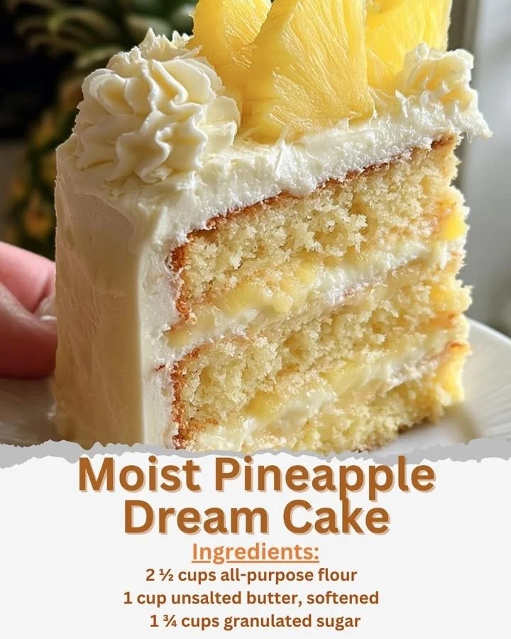 Delicious moist pineapple dream cake slice topped with whipped cream and pineapple slices