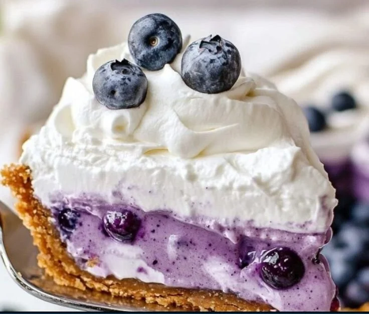 No Bake Blueberry Cream Pie topped with fresh blueberries and whipped cream