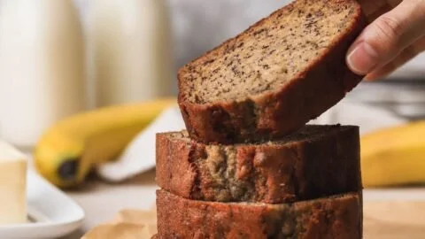 Freshly baked old fashioned banana bread with walnuts and banana slices