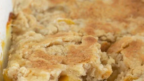 Delicious homemade Peach Cobbler dessert served in a baking dish
