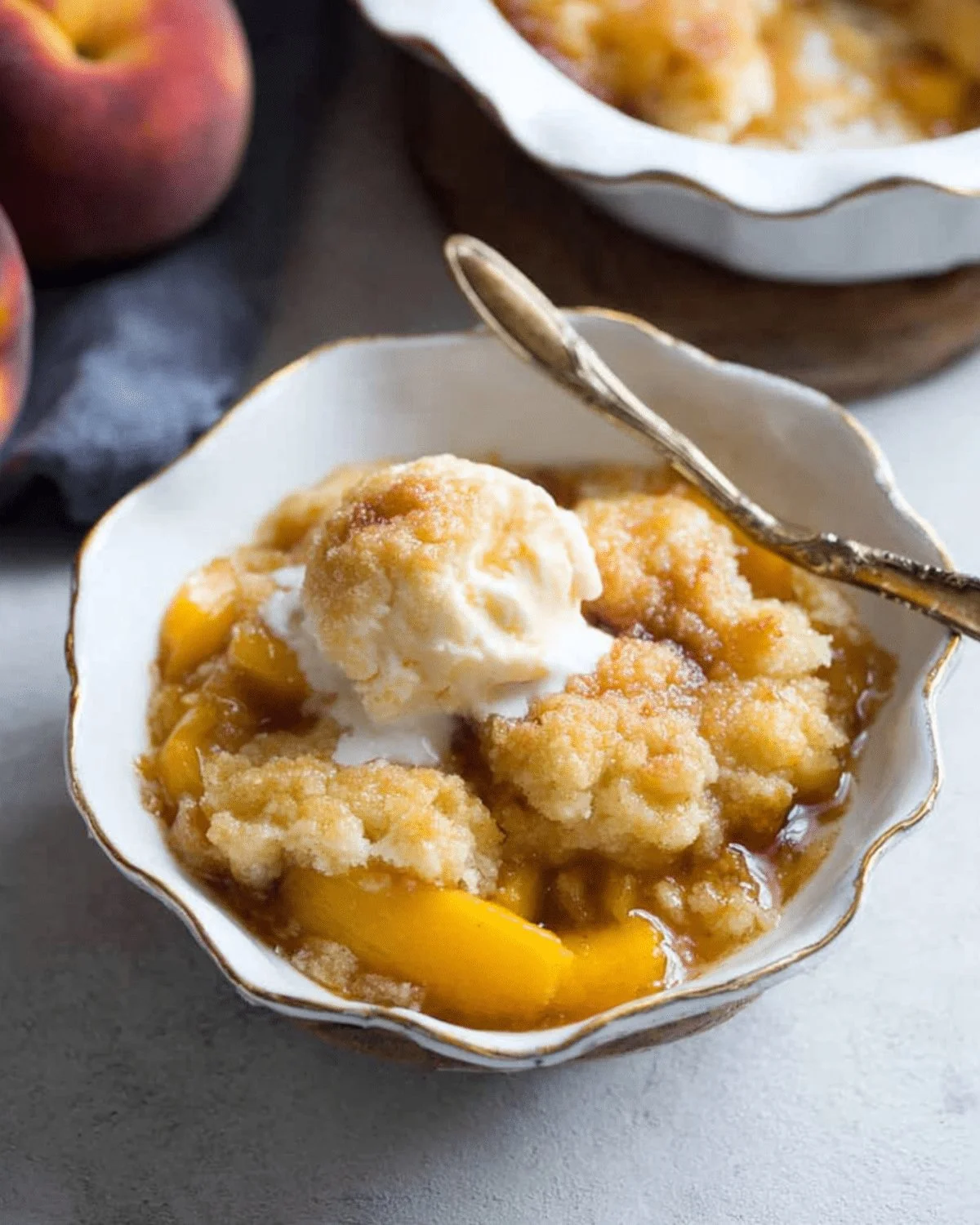 Delicious homemade Peach Cobbler with golden crust and fresh peaches
