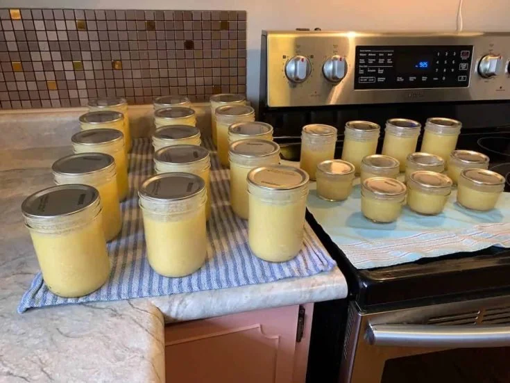 Jars of pressure canned butter ready for long-term storage.