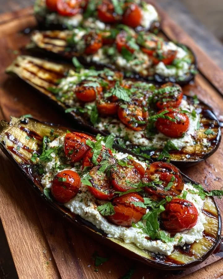 Roasted eggplant boats filled with herbed ricotta and tomatoes dish
