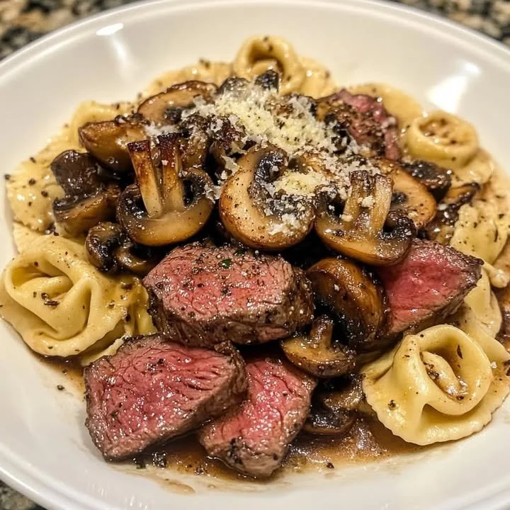 Seared steak tips served with balsamic mushroom parmesan tortellini