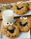 Smiley face chocolate chip cookies on a cooling rack