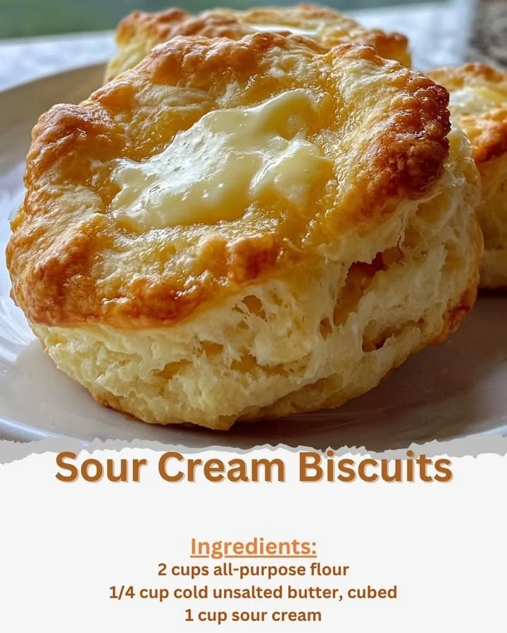 Freshly baked sour cream biscuits on a wooden table