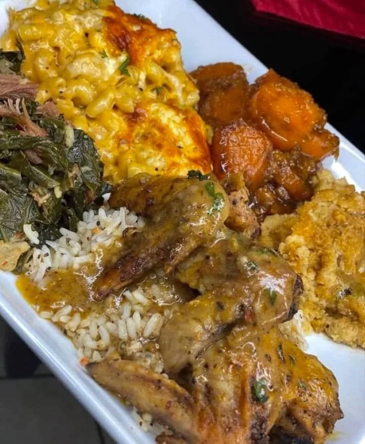 A delicious Southern soul food plate with fried chicken, collard greens, and cornbread.