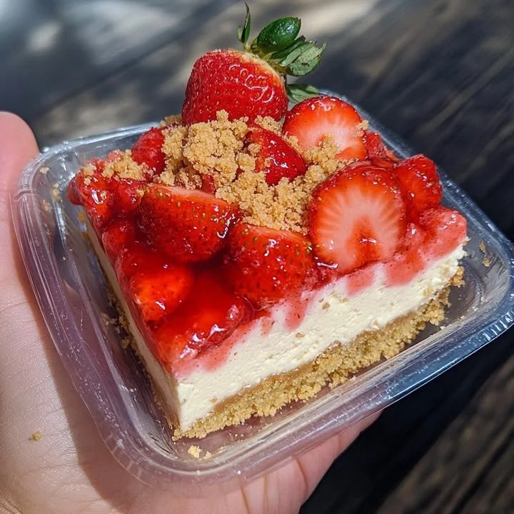Delicious strawberry crunch cheesecake with vibrant strawberry topping