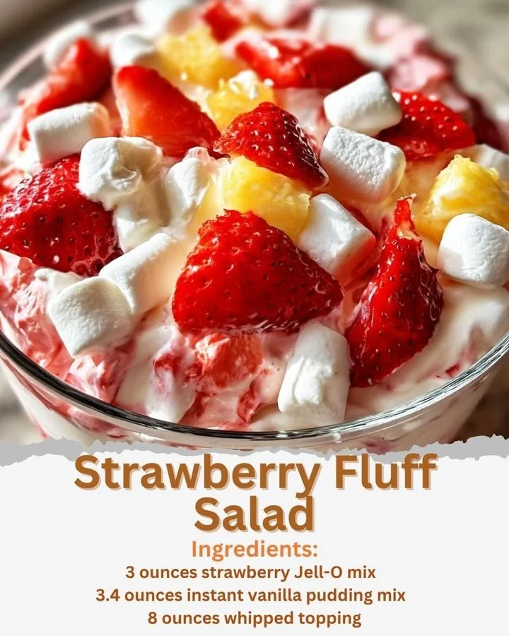 Bowl of colorful Strawberry Fluff Salad with whipped cream and strawberries