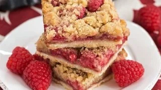 Delicious streusel topped raspberry squares on a dessert plate