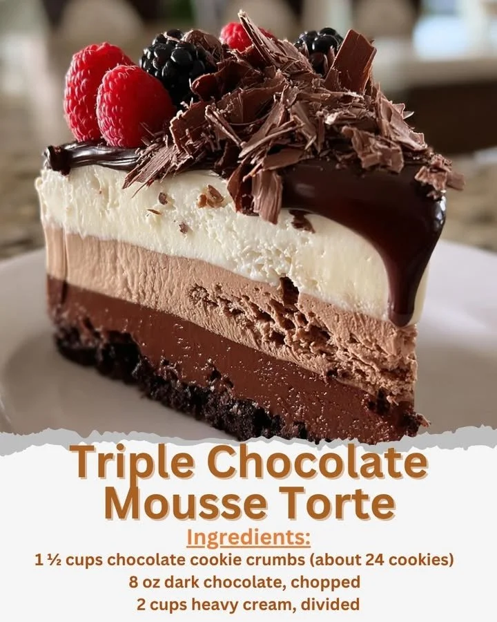Delicious triple chocolate mousse cake with layers of chocolate and whipped cream