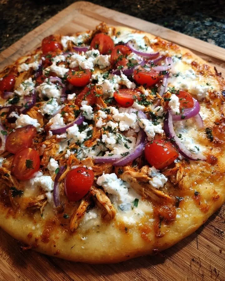 Tzatziki Chicken Pizza topped with fresh ingredients and tzatziki sauce