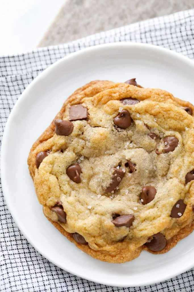 Freshly baked ultimate chocolate chip cookies on a baking tray