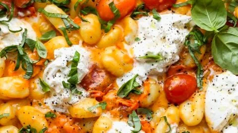 30-minute creamy tomato gnocchi topped with burrata cheese in a bowl