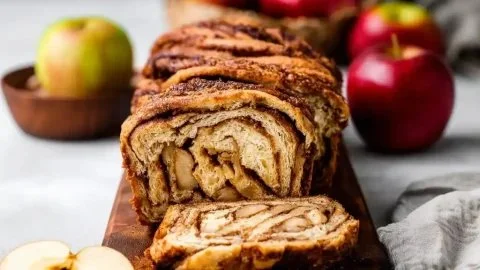 Homemade Apple Cinnamon Babka bread with a golden crust and swirls of apple filling