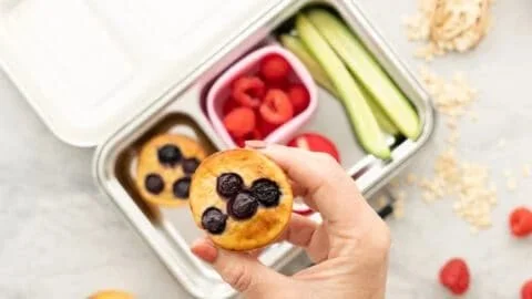 Freshly baked banana blueberry oatmeal muffins on a plate