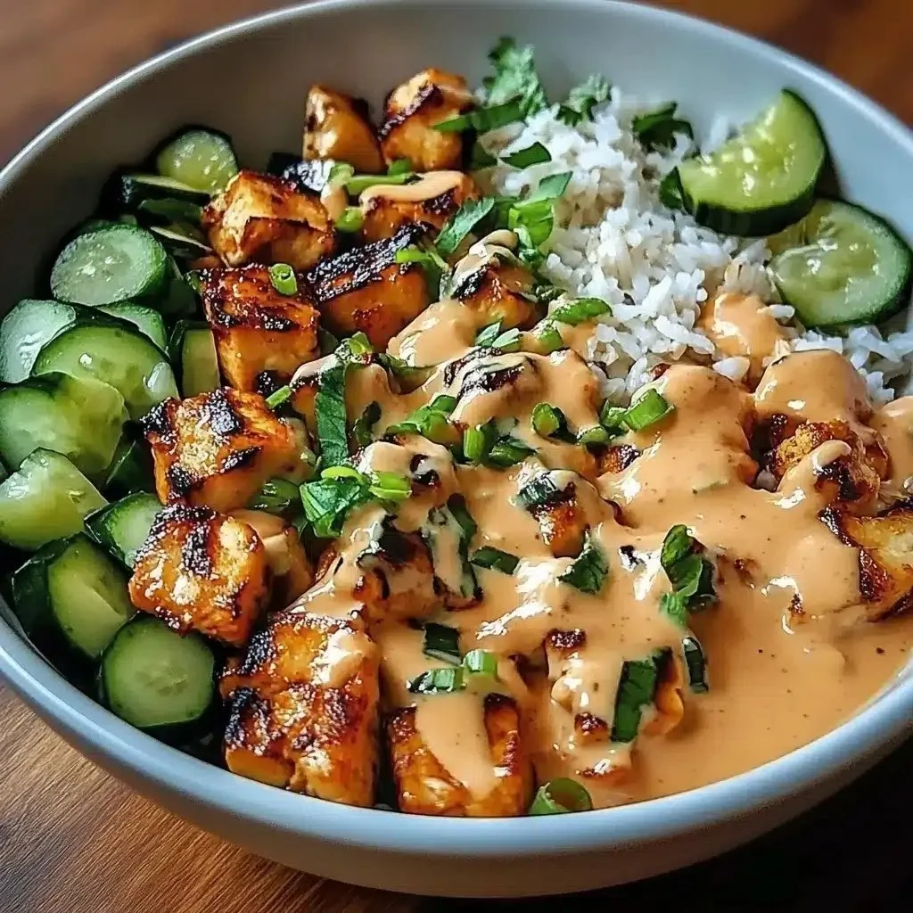Delicious Bang Bang Chicken Bowl with chicken, sauce, and vegetables