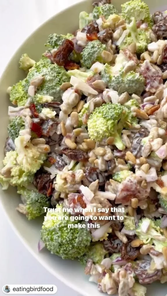 Delicious broccoli salad with nuts and cranberries in a bowl