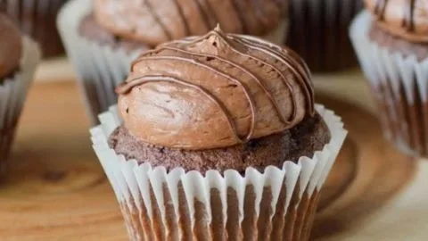 Delicious chocolate buttercream frosting spread over a chocolate cake
