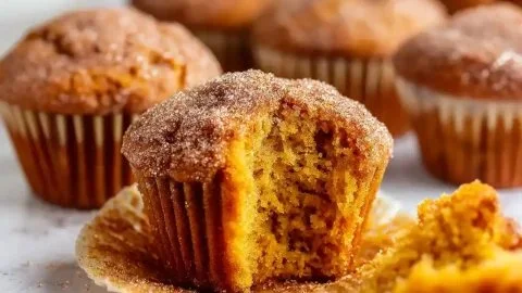 Moist and fluffy cinnamon sugar pumpkin muffins fresh out of the oven