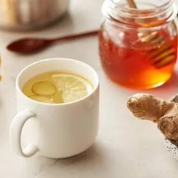 Homemade cold remedy tea brewed with herbs and spices for relief from cold symptoms.