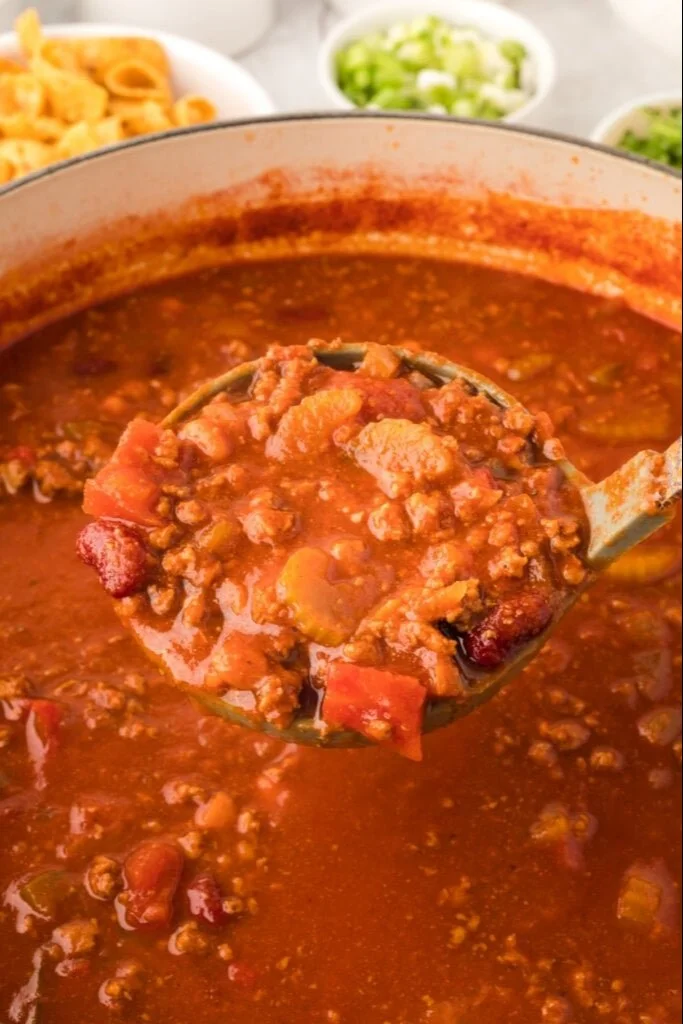 Delicious copycat Wendy's Chili served in a bowl with toppings.