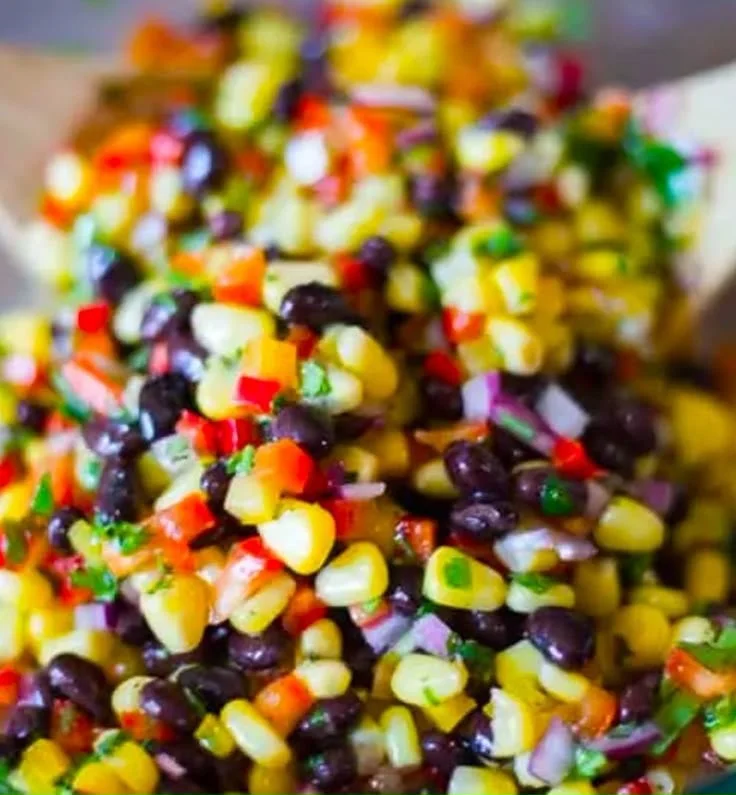 Corn and black bean salad with Mexican vinaigrette in a bowl.