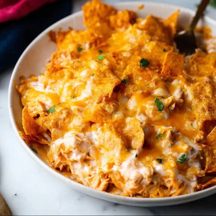 Delicious Doritos Cheesy Chicken Casserole fresh out of the oven, topped with crispy chips.