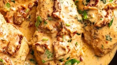 Delicious Easy Marry Me Chicken served on a plate with herbs and sauce