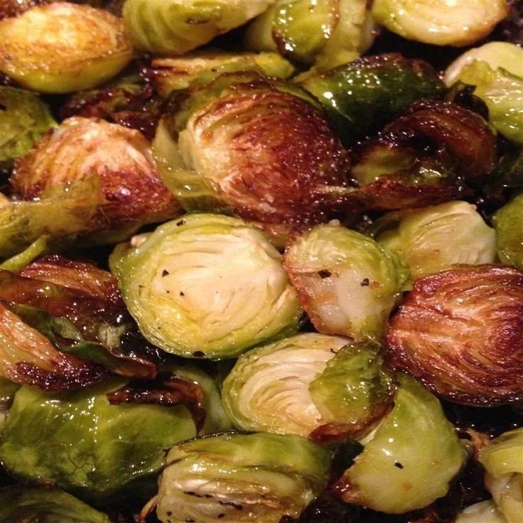 Deliciously roasted Brussels sprouts on a plate, garnished and ready to serve.