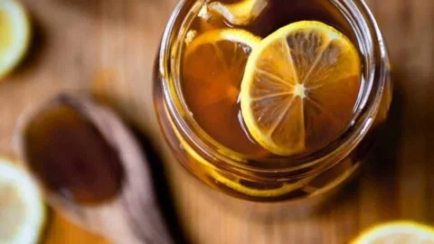 A warm cup of Ginger Lemon Honey Tea with fresh ingredients for a healthy boost.