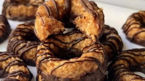 Delicious homemade Samoas cookies with chocolate, caramel, and coconut.
