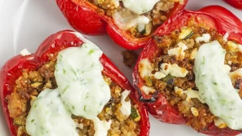 Greek stuffed peppers filled with rice, herbs, and feta cheese