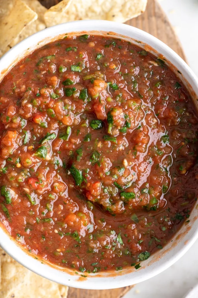 Bowl of homemade restaurant-style salsa with fresh ingredients and tortilla chips