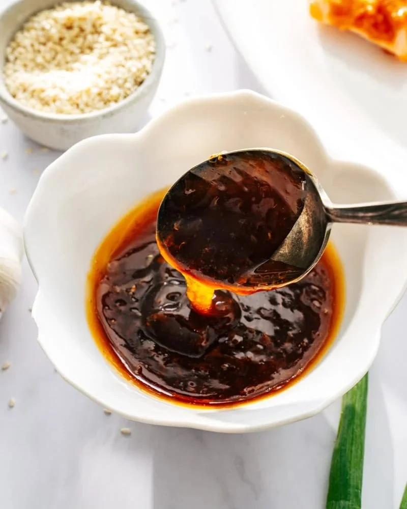 Homemade honey garlic sauce in a glass jar, perfect for dipping and cooking.