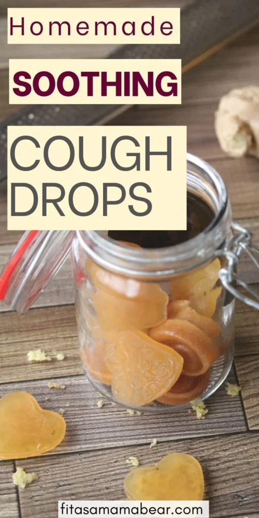 Homemade honey lemon cough drops in a glass jar with ingredients.