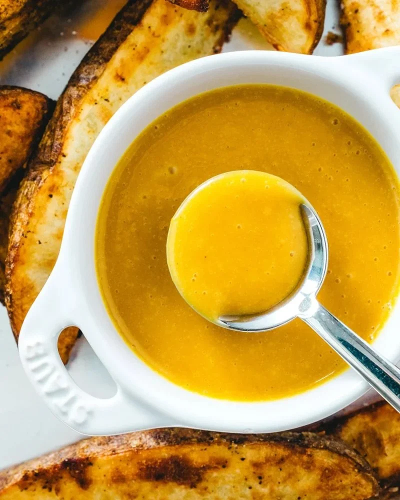 Homemade honey mustard sauce in a jar, perfect for salads and marinades.