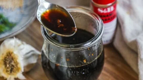 Bowl of Honey Soy Garlic Sauce with garlic and honey ingredients