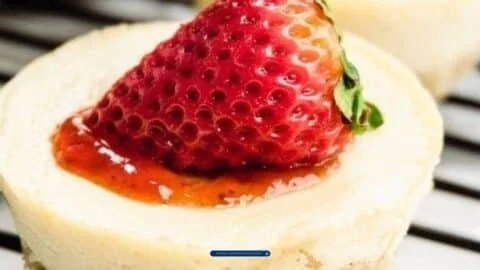 Delicious Keto Cheesecake Bites on a plate topped with fresh berries