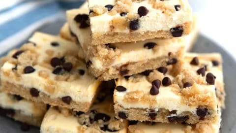 Keto chocolate chip cookie cheesecake bars on a plate, dessert delight