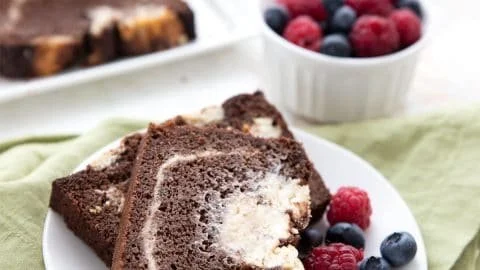 Keto Chocolate Zucchini Bread freshly baked and sliced on a wooden board