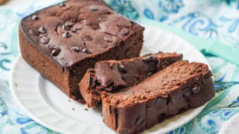 Moist Keto Chocolate Zucchini Bread slices on a wooden board
