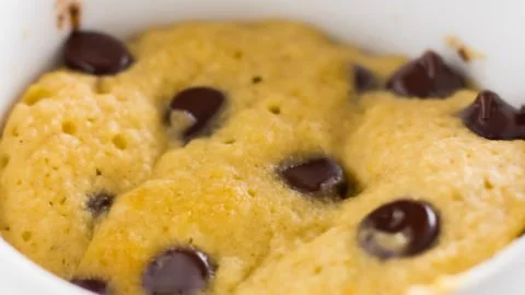 Delicious Keto Peanut Butter Mug Cake topped with peanut butter and chocolate