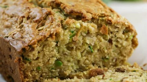 Sliced low sugar zucchini bread served on a plate with a fork