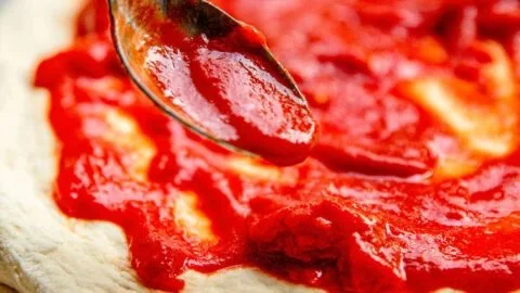 Homemade pizza sauce made from fresh tomatoes and herbs.