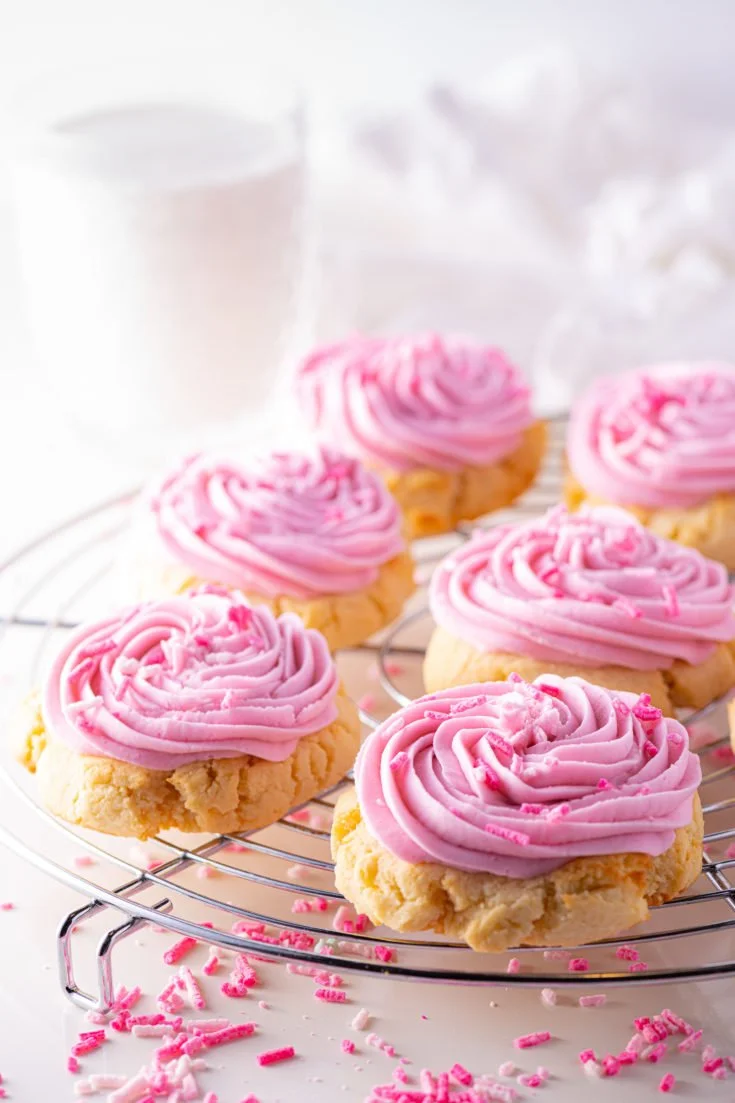 Frosted keto sugar cookies on a plate, perfect for low-carb diets.