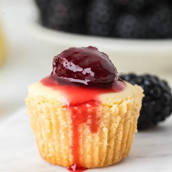 Delicious mini keto cheesecakes topped with fresh berries