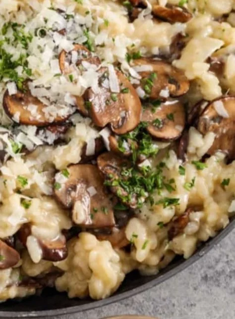 Creamy Mushroom Risotto garnished with parsley in a white bowl