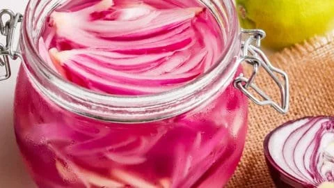 Jar of no-sugar pickled onions ready to enhance meals.
