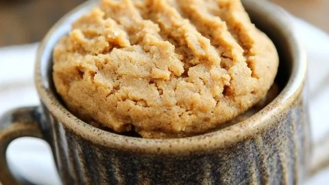Peanut Butter Cookie in a Mug topped with a sprinkle of sea salt